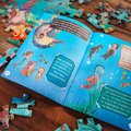 Meerjungfrauen. Puzzle im Buch. 100 Teile